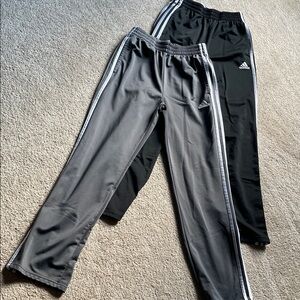 Two pair of kids Adidas track pants, both size large